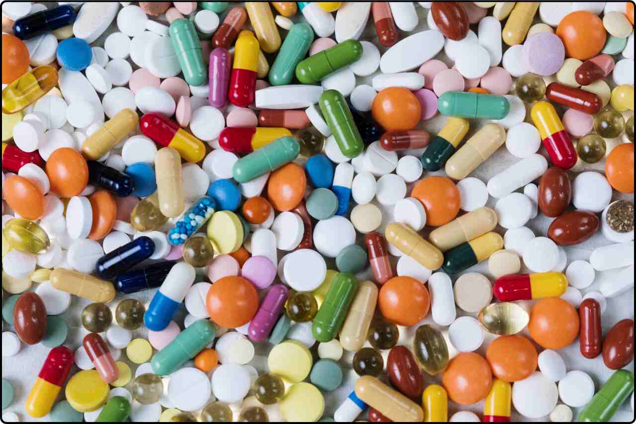 Flatlay shot featuring various medications, including tablets and capsules.